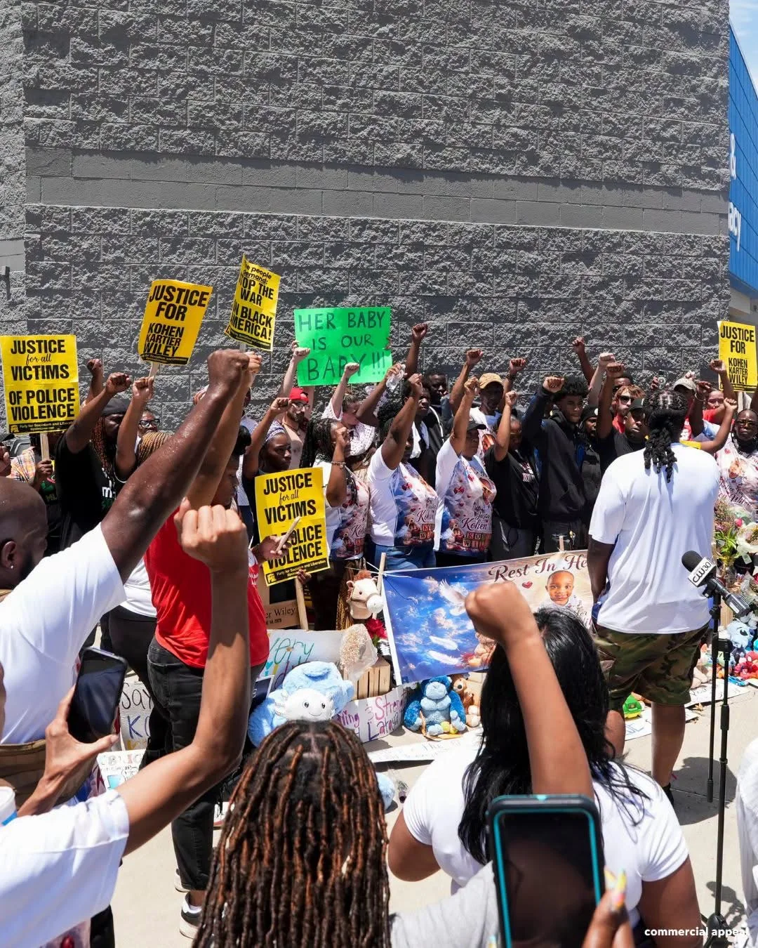 A crowd gathered with signs calling for the release of footage